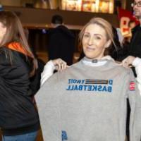 An alum with her Piston and Laker co-branded shirt.